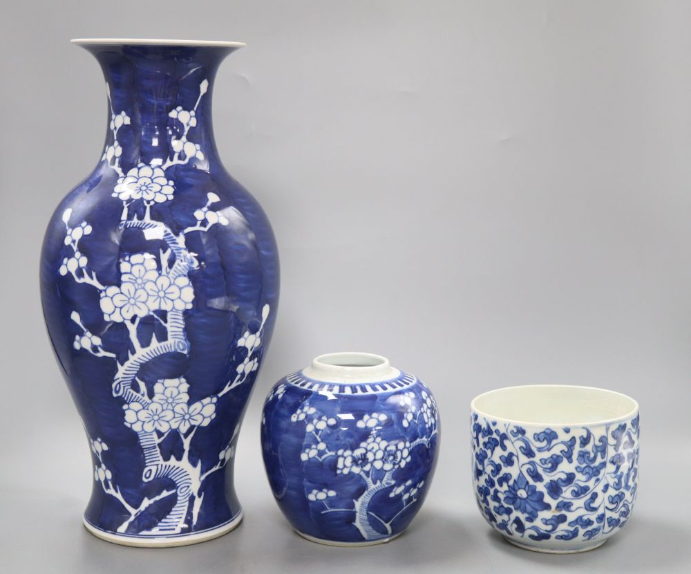 A Chinese blue and white prunus vase, height 36.5cm, jar and a kangxi blue and white jar (lacking cover)